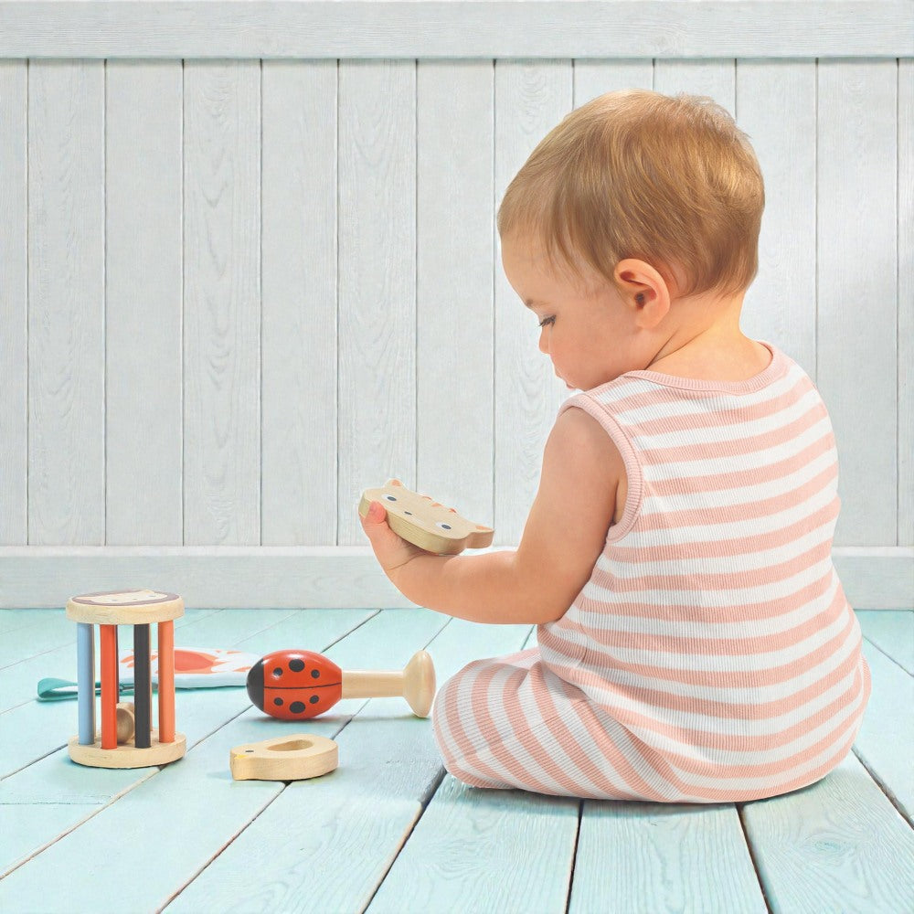 Wooden baby toys including cat mirror kitten rattle and bird teether from Mentari