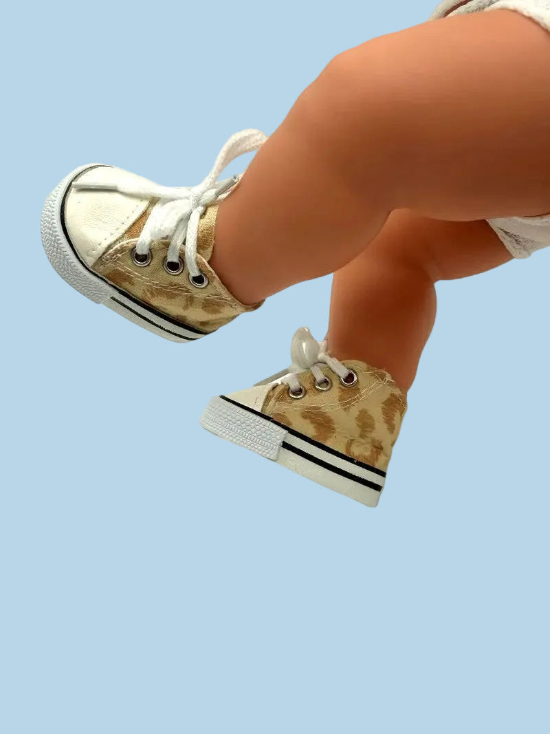 Gold high-top sneakers with white laces on a light blue background