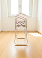 Full view of collapsible steel frame doll high chair in vintage Verona Blues pattern