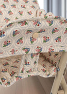 Close-up of Verona Blues cottage floral fabric with botanical print on padded doll high chair
