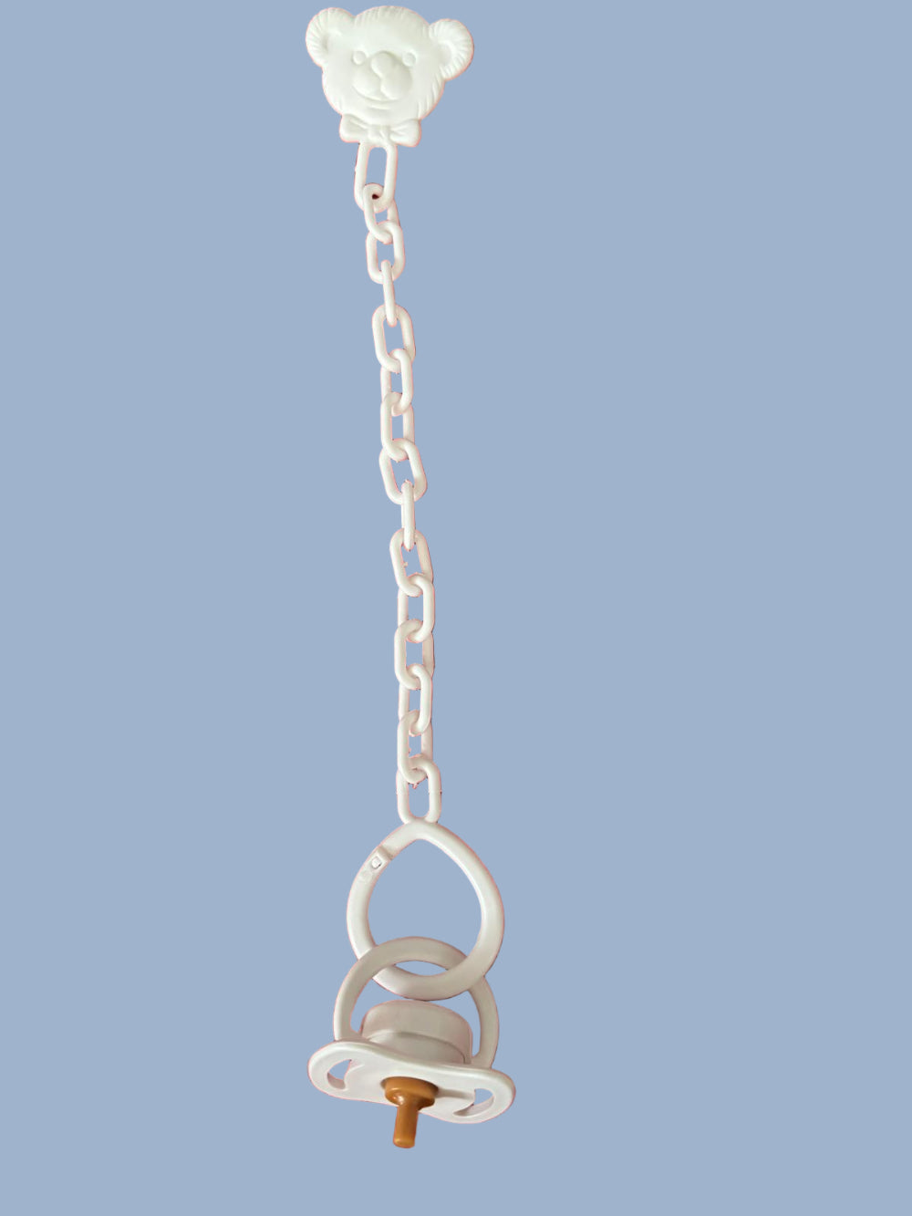 White pacifier on white chain
