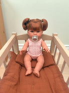 Realistic European-crafted baby girl doll with red ponytails and freckles