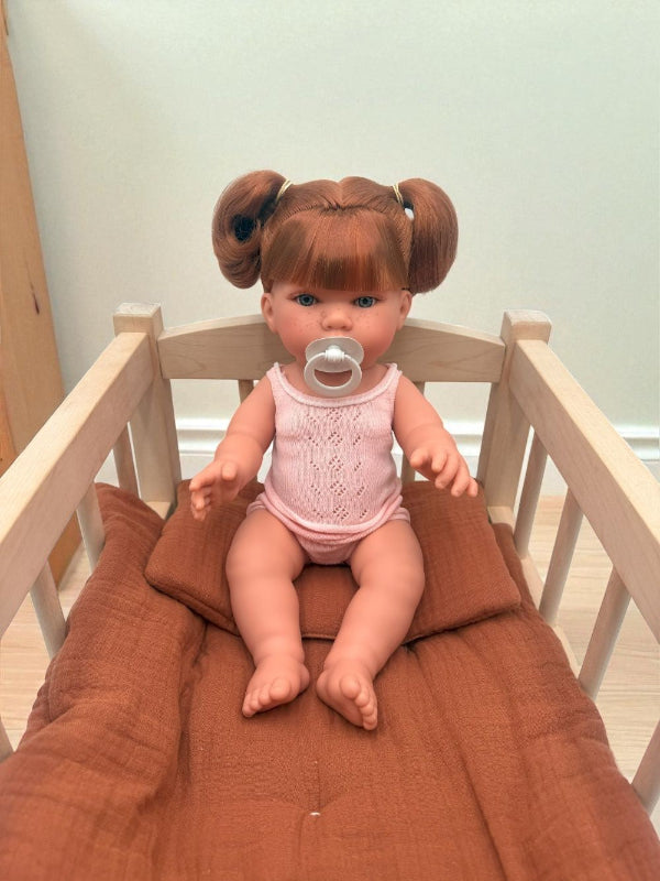 Realistic European-crafted baby girl doll with red ponytails and freckles