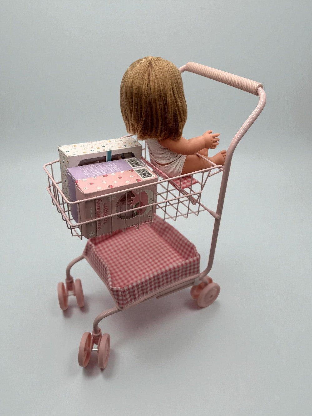 13-inch doll seated comfortably in gingham cart showing perfect proportions for realistic shopping play