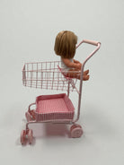 Upper wire basket filled with toy groceries demonstrating generous storage space for shopping adventures