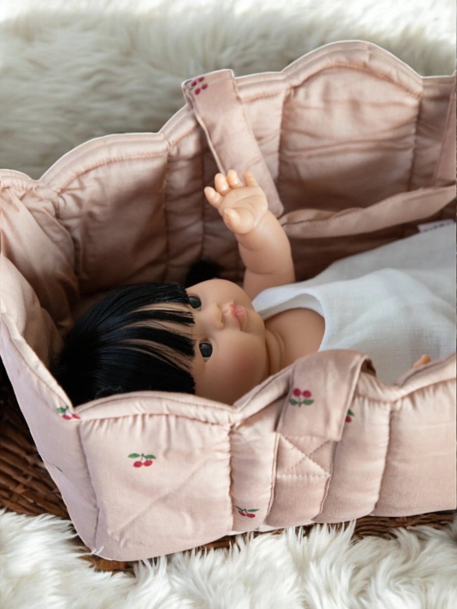 Playroom favorite: natural fiber baby doll bassinet for nurturing play