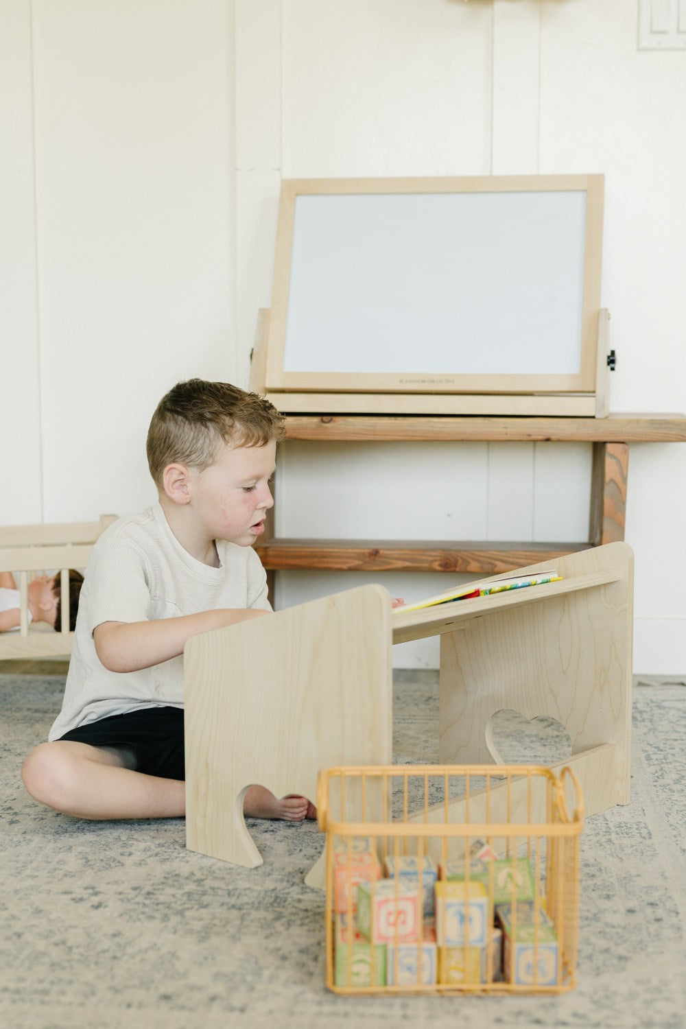 Child reading on lap desk