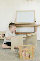 Child reading on lap desk