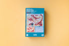 Puzzle box with dinosaur illustrations on a beige background