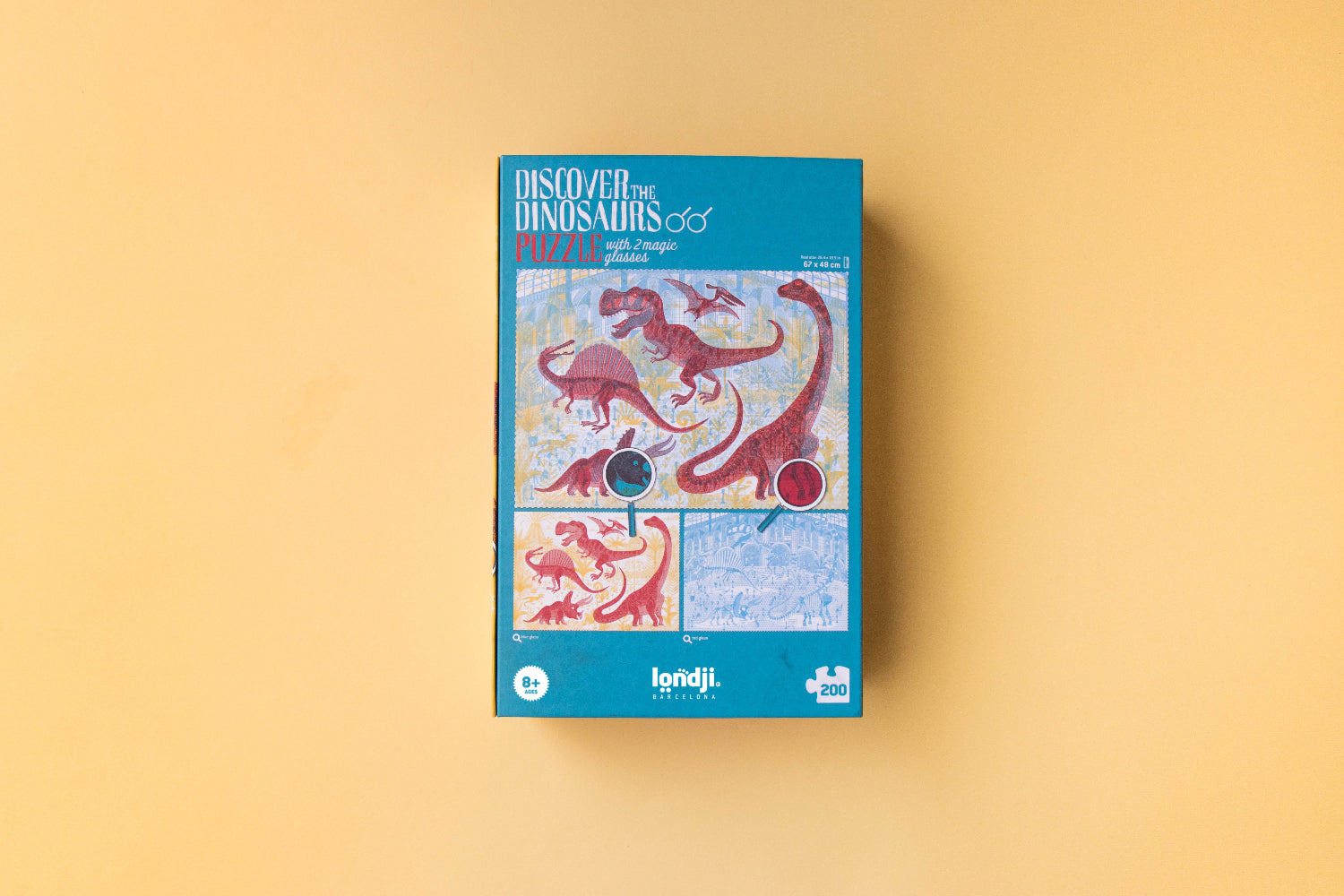 Puzzle box with dinosaur illustrations on a beige background
