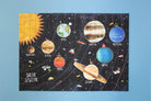 Solar system-themed puzzle on a blue background