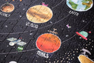 Solar system-themed puzzle with planets and astronauts on a black background