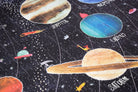 Children's space-themed puzzle with illustrations of planets and stars on a dark background.