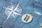Jigsaw puzzle with a compass and map design on a blue background