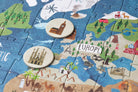 Children's puzzle with a map of Europe featuring landmarks and countries.