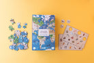 Children's puzzle set with world map design on a yellow background