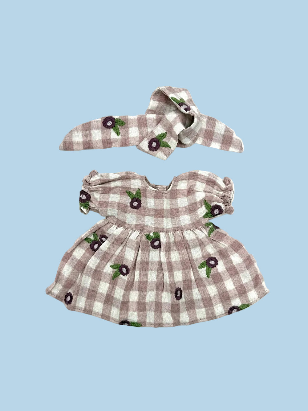A two-piece doll outfit set featuring a strapless dress and matching headband. The fabric has a brown and white gingham check pattern with small embroidered cherry motifs.