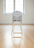Fleur Rosier doll high chair with blue floral print quilted seat featuring botanical garden design and champagne folding metal frame