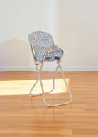 Beautifully arranged Fleur Rosier doll high chair as thoughtful gift for encouraging realistic doll care and feeding play