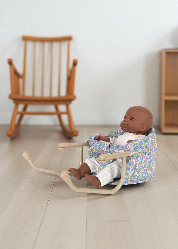 Fleur Rosier table chair with blue floral print fabric and champagne clamp frame, shown with doll seated at table
