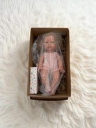 Handmade anatomically correct baby doll with textured blonde curls