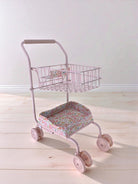 Professional-grade front wheels on shopping cart showing smooth-rolling capability for easy navigation