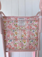 Close-up of Garden Blush pattern showing delicate pink blooms and botanical design on premium peach skin polyester