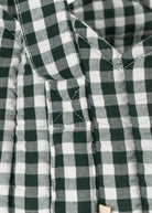 Premium green and white check cotton construction showing durable weave and classic gingham pattern