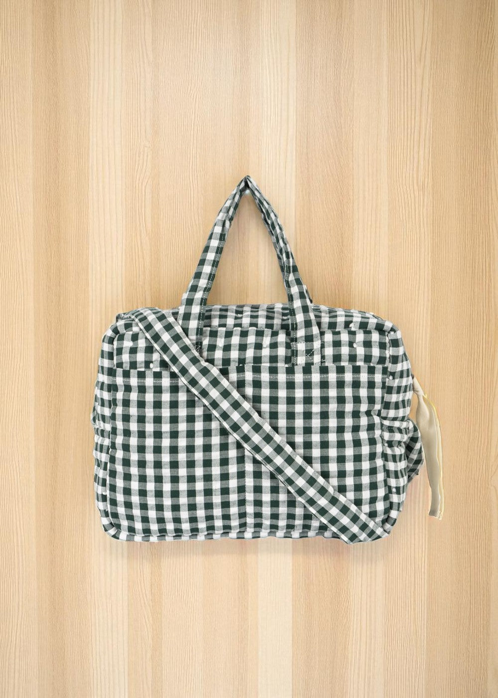 Green gingham check doll diaper bag with adjustable crossbody strap for pretend play