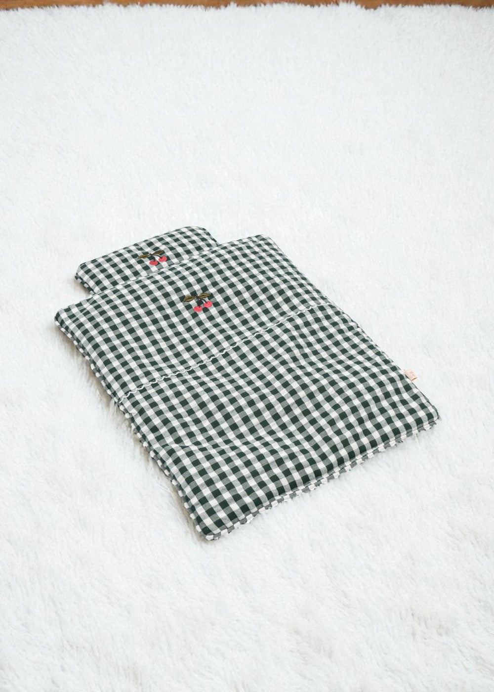 Green Check bedding set with classic gingham blanket and pillow arranged together showing coordinated farmhouse design