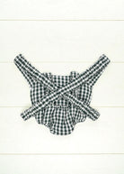 Back view of green gingham doll carrier showing comfortable strap system and complete pattern coverage