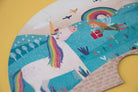Children's puzzle with a unicorn and fairy design on a yellow background