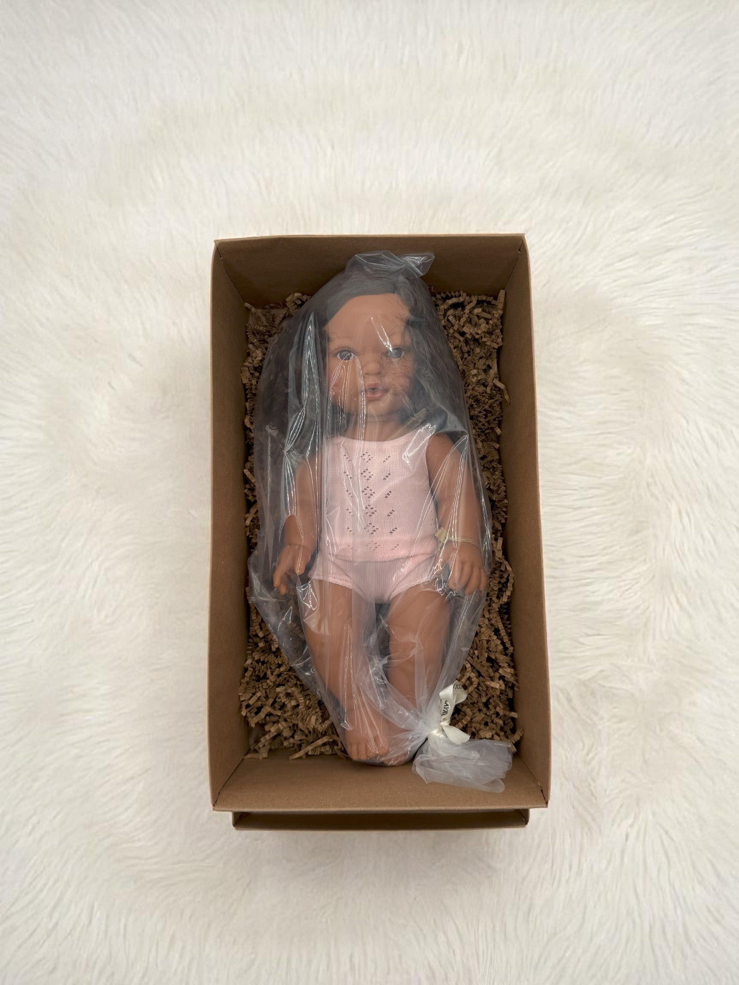 Real life baby doll Havana with gorgeous curly brunette locks for meaningful developmental play