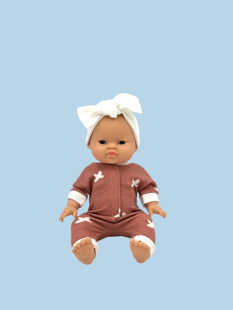 Folk-art style doll clothing with traditional motifs