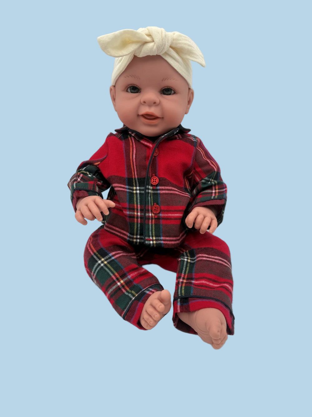Complete doll sleepwear set in classic red, navy, and green tartan pattern with notched collar