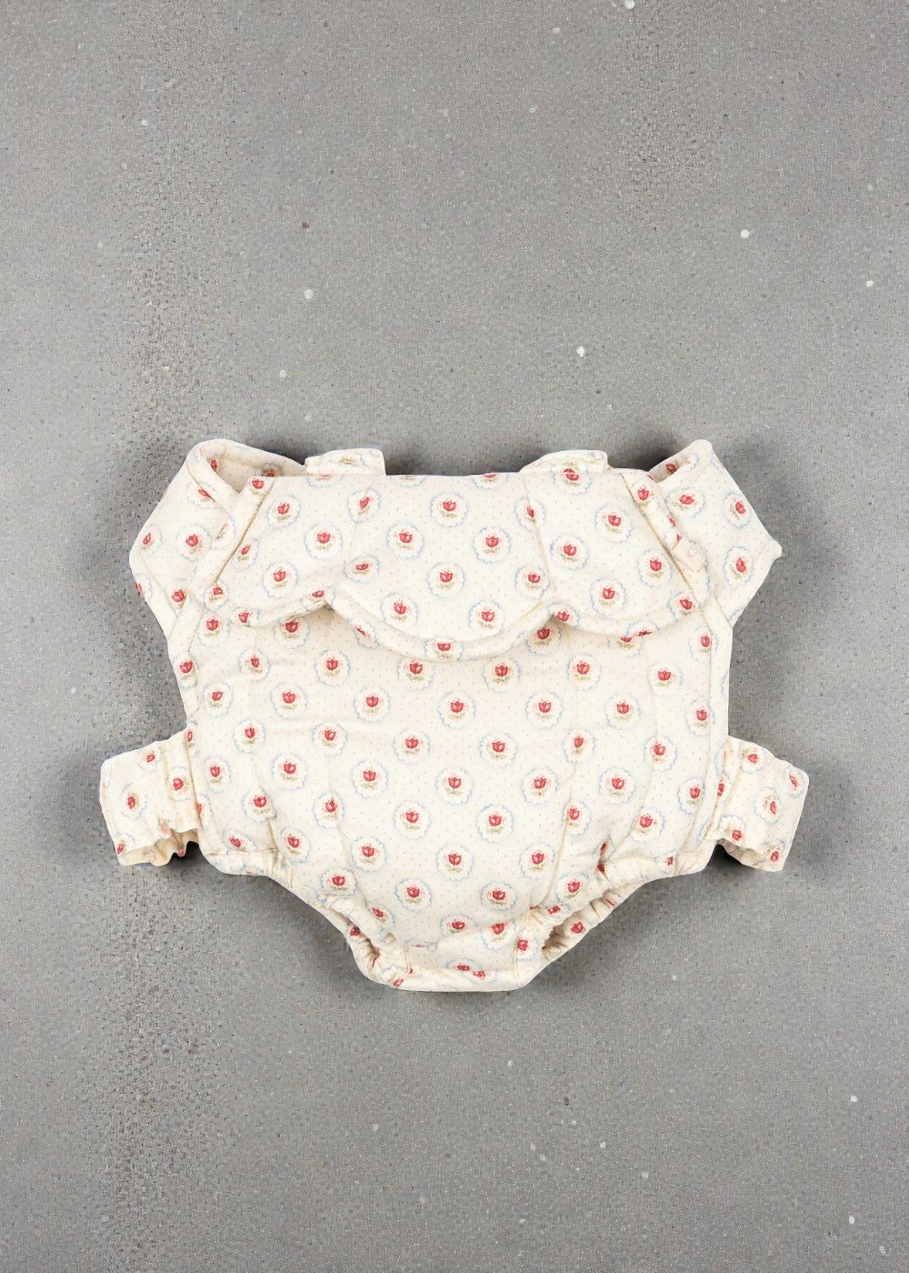 Konges Sløjd Mirage doll carrier with red tulip print and elastic shoulder straps