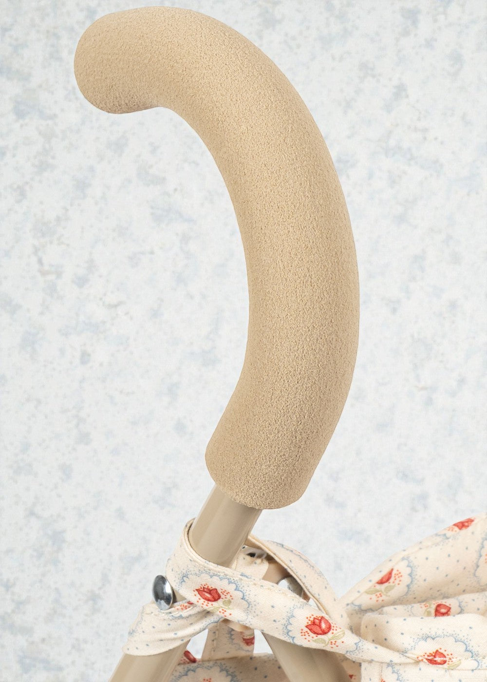 Red tulip pattern doll buggy with velcro fabric attachment and sturdy push frame