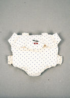 Konges Sløjd Estate Dot doll carrier with navy polka dots and cherry embroidery