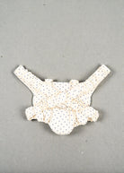 Navy dot baby carrier with elastic shoulder straps for hands-free doll play