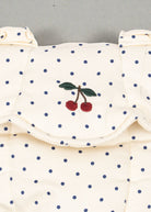 OEKO-TEX cotton doll carrier showing cream fabric with blue polka dot pattern