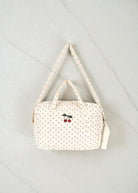 Konges Sløjd Estate Dot doll diaper bag with navy polka dots and cherry embroidery