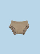 Beige ribbed baby bloomers with ruffled edges