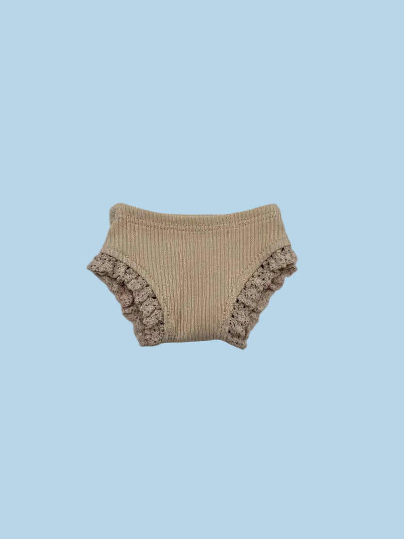 Beige ribbed baby bloomers with ruffled edges
