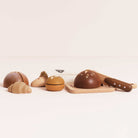 British made wooden bakery toys including seeded loaf croissant and baguette with cotton bag