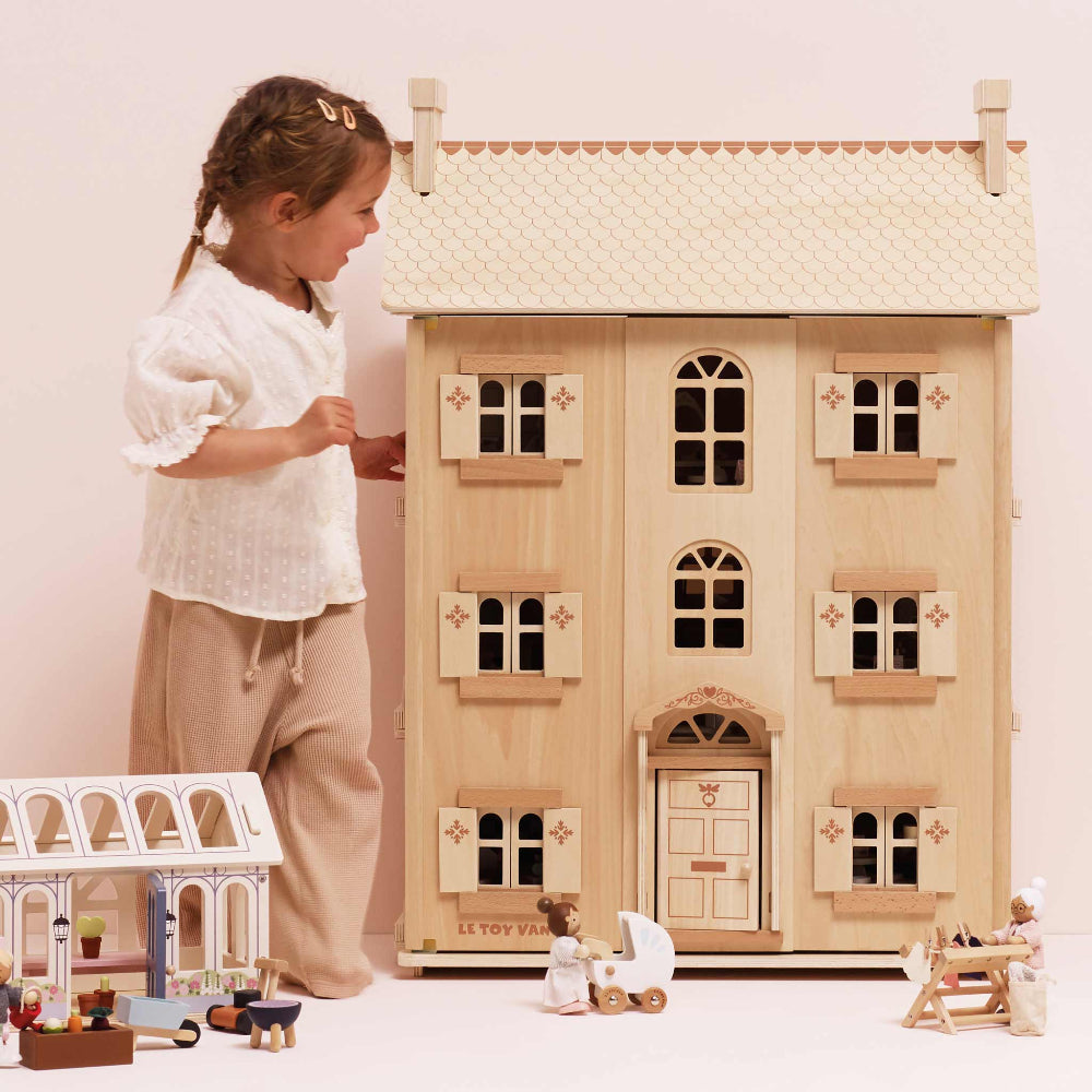 Large four-story Le Toy Van dollhouse in natural wood finish