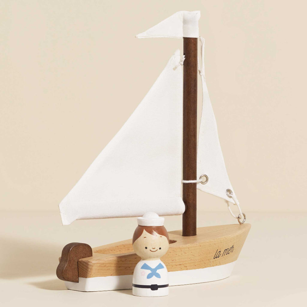 Le Toy Van handcrafted wooden sailboat with cotton sails and sailor