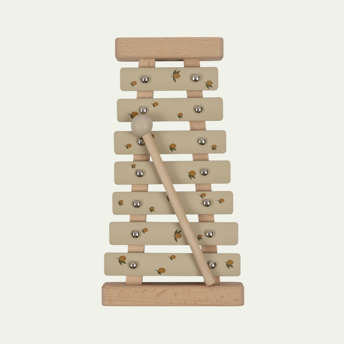 Wooden lemon print xylophone with sage green bars and natural wood mallet on white background