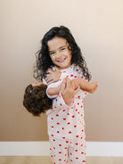 Child wearing Valentine Rose Hearts ribbed cotton play set during active indoor play