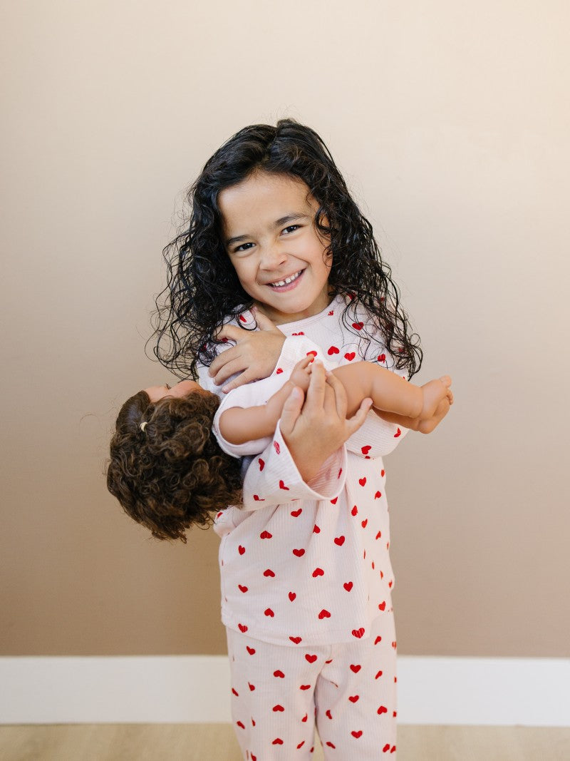 Child wearing Valentine Rose Hearts ribbed cotton play set during active indoor play