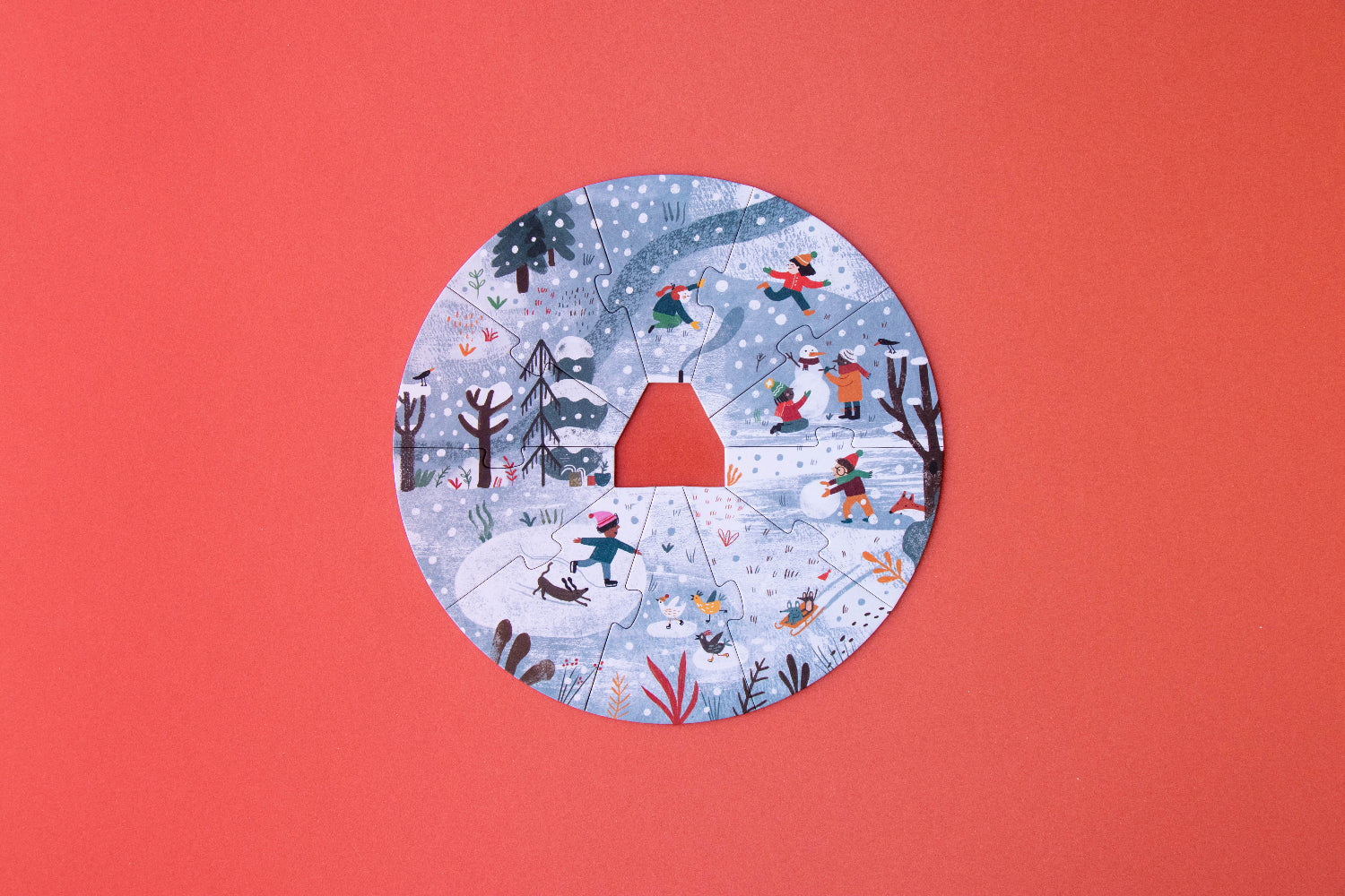 Circular winter scene illustration on a red background